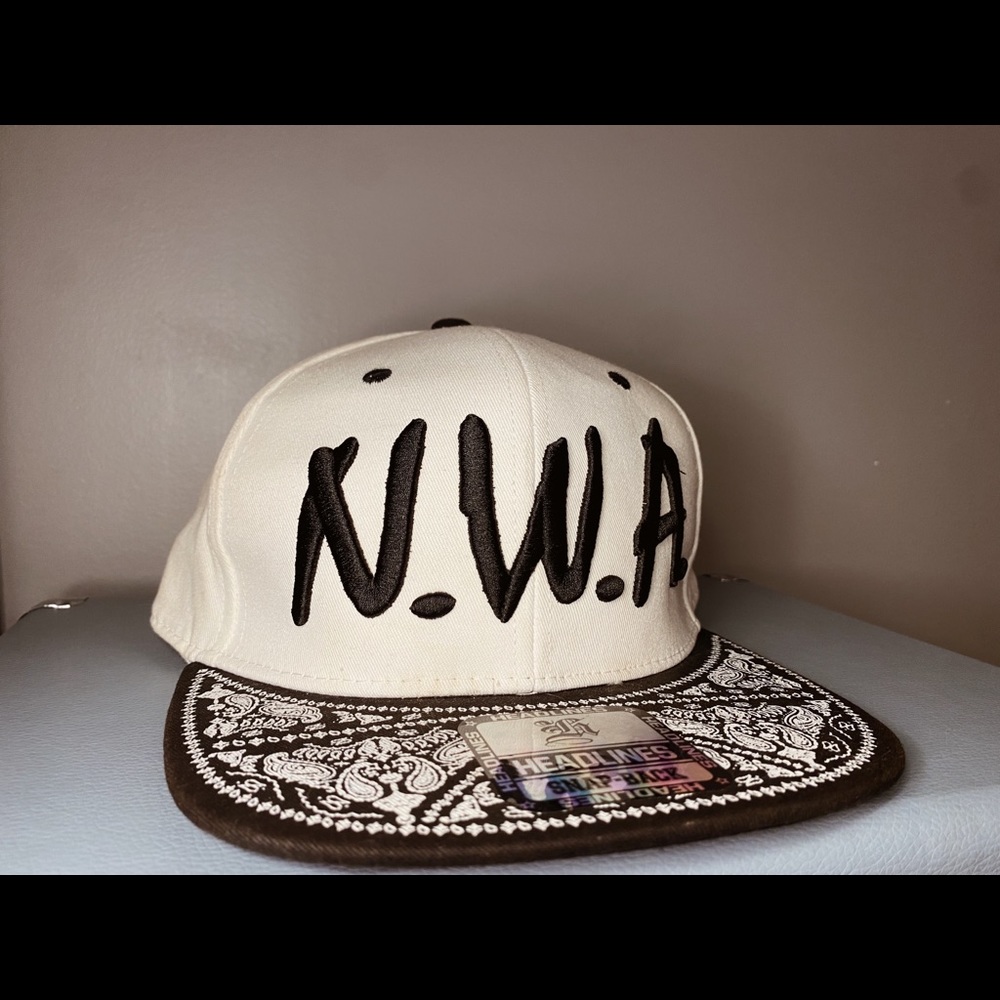 Headlines Snap-back/fitted hat. Size is adjustable, fits most people.